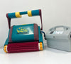Robot piscina Dolphin Diagnostic 2001 Digital con alimentatore, su superficie bianca.